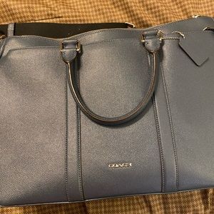 Coach navy blue briefcase. Come with shoulder strap. Multiple compartments.